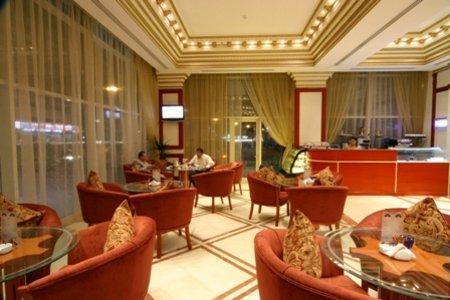 Emirates Palace Hotel Suites Шарджа Ресторант снимка